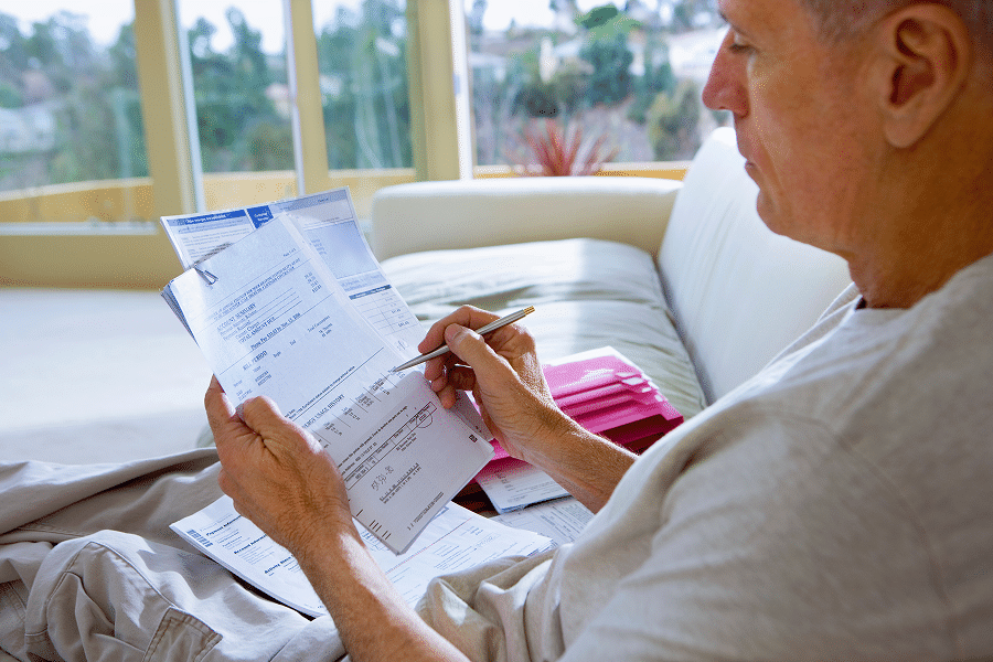 Senior patient reviewing healthcare documents and learning about Medicare hospice coverage